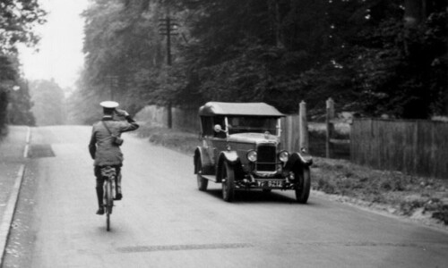 An early AA patrol salutes a passing car